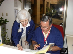 Volunteers reading notes Volunteers reading notes